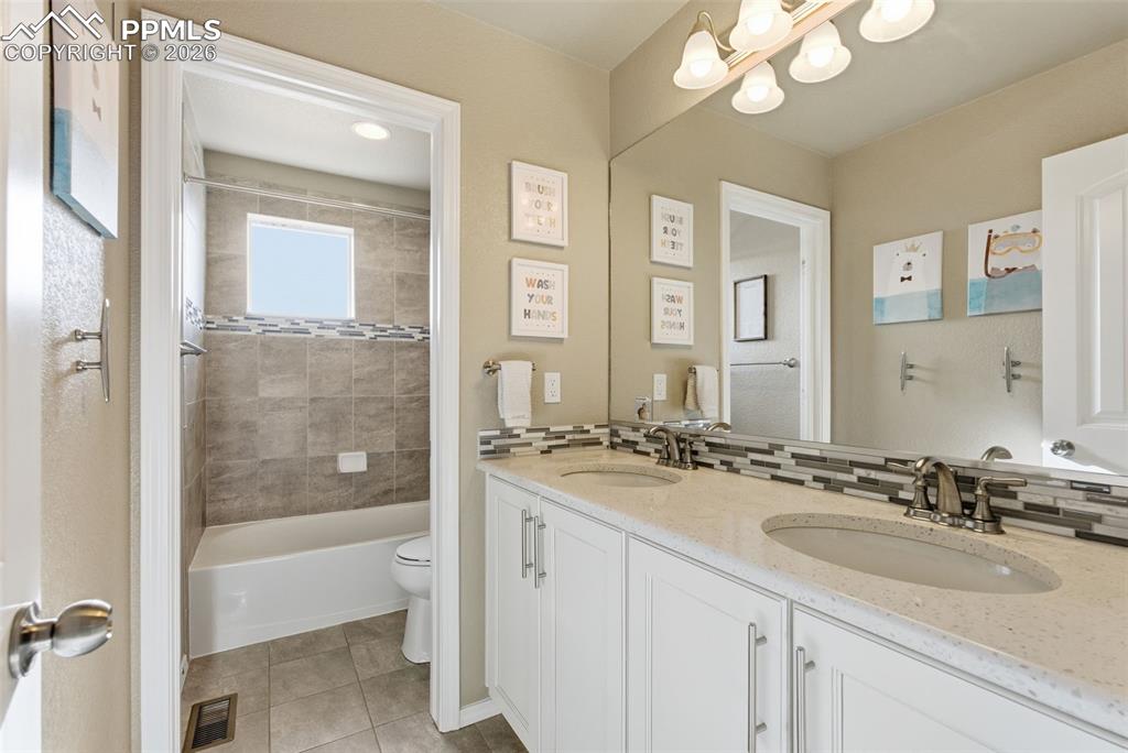 Image 26 of 47: Upstairs Hall Bath