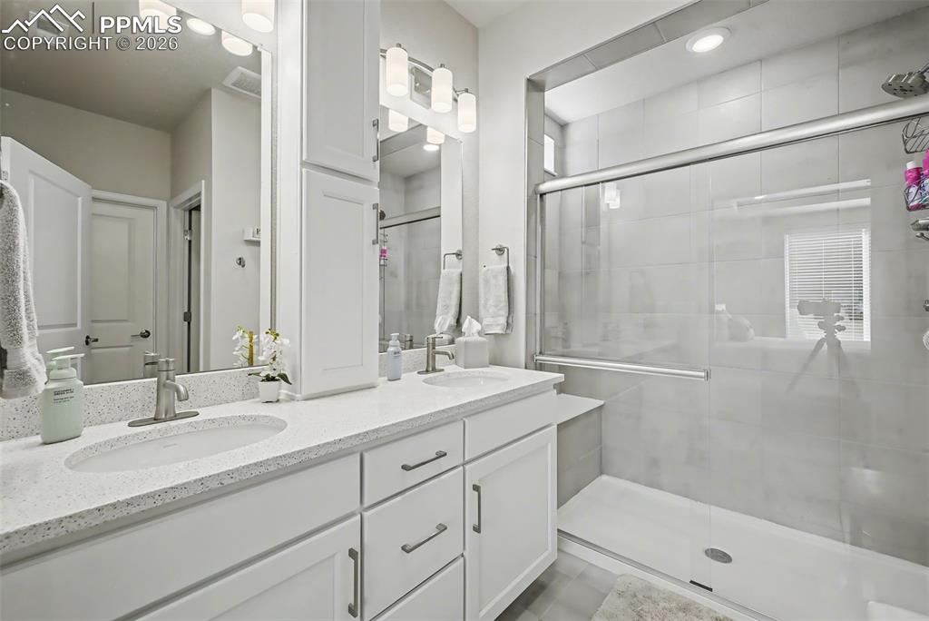 Image 26 of 30: MASTER BATHROOM WITH DOUBLE VANITIES