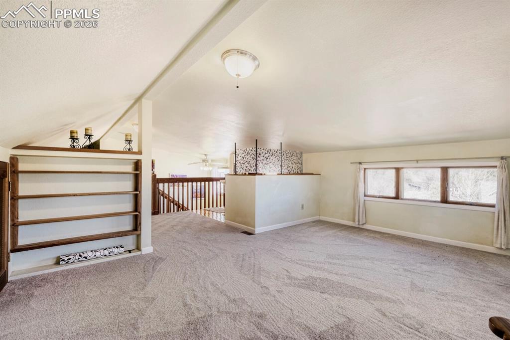 Image 31 of 47: Upper level loft/master bedroom/bath