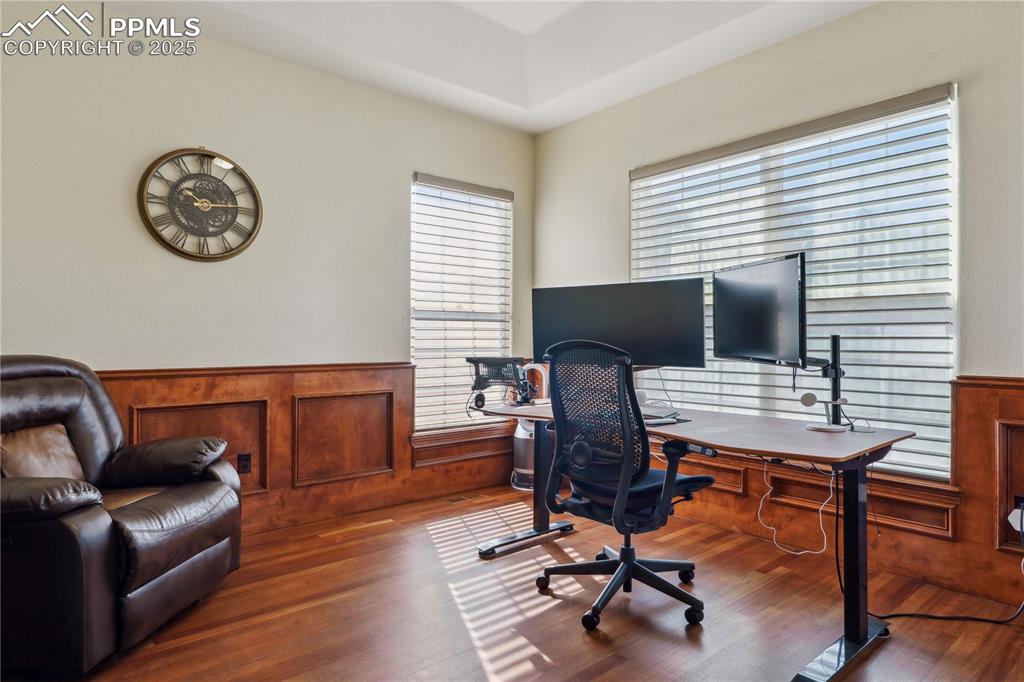 Image 5 of 41: Office with wainscoting and wood finished floors