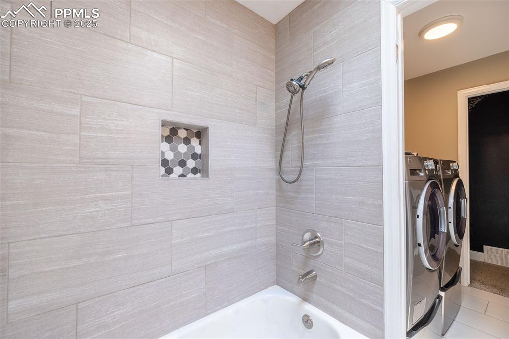 Image 21 of 28: Full bath with separate laundry access