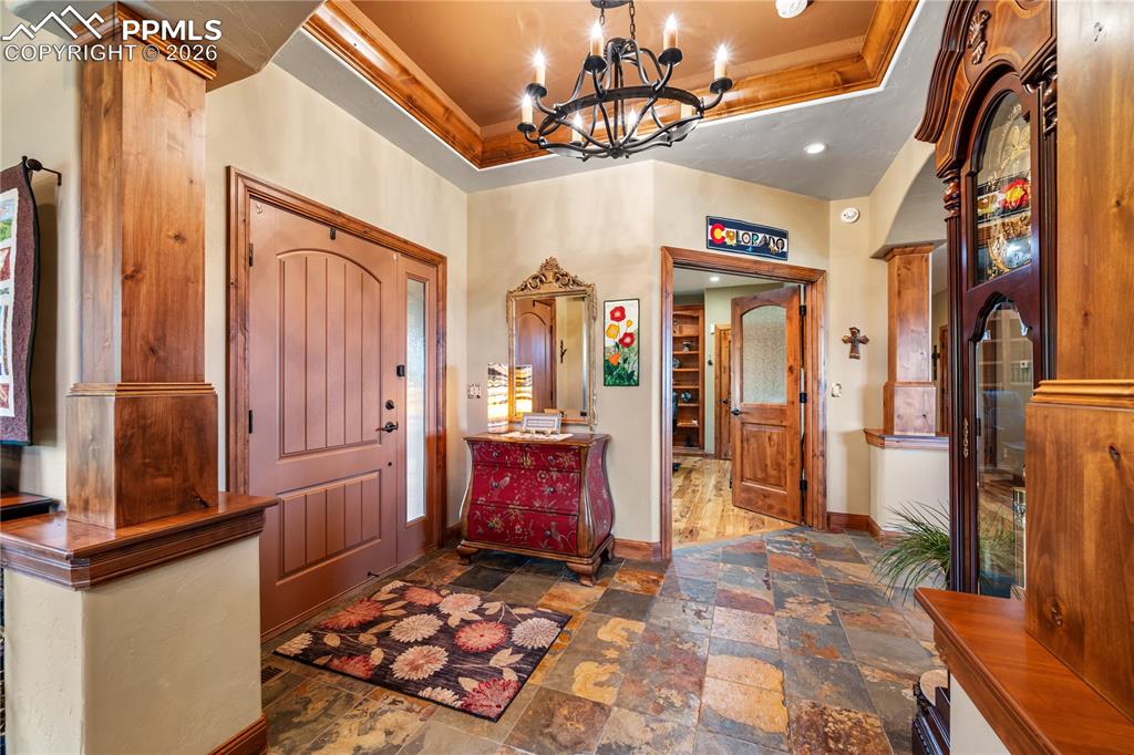 Image 6 of 45: View from formal dining entrance across foyer to office