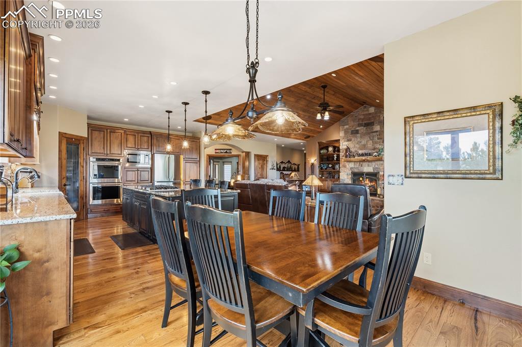 Image 8 of 45: Eating area adjoining kitchen looking into great room and foyer