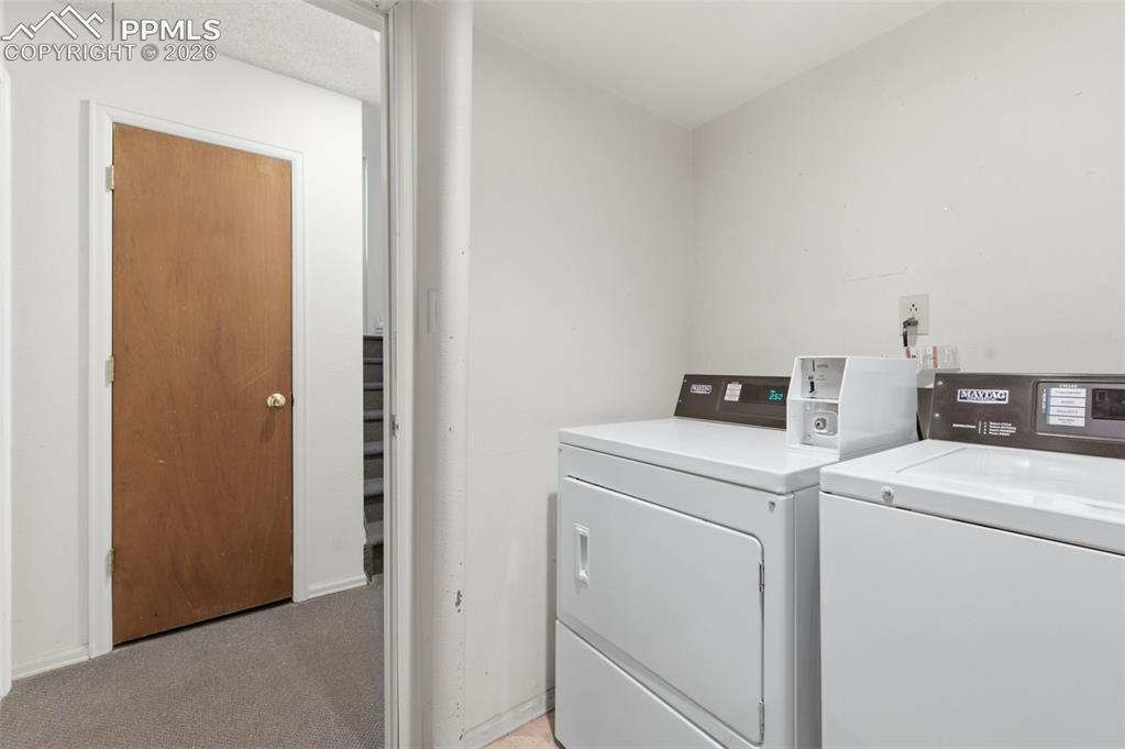 Image 23 of 26: Common coin operated Laundry area located on the lower level