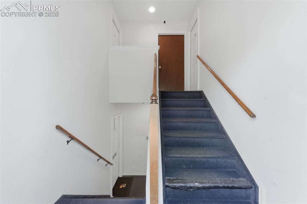 Image 4 of 26: Entryway - stairs to the 2 units on the upper level and 2 units on the lowe