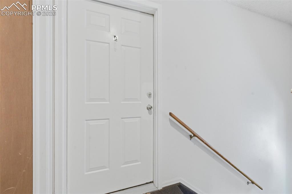 Image 6 of 26: door to Unit D - the unit available to tour