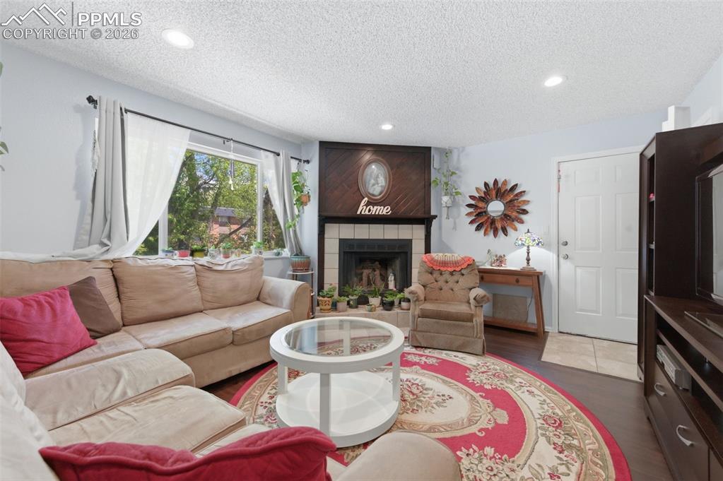 Image 8 of 26: Wood burning fireplace in each unit