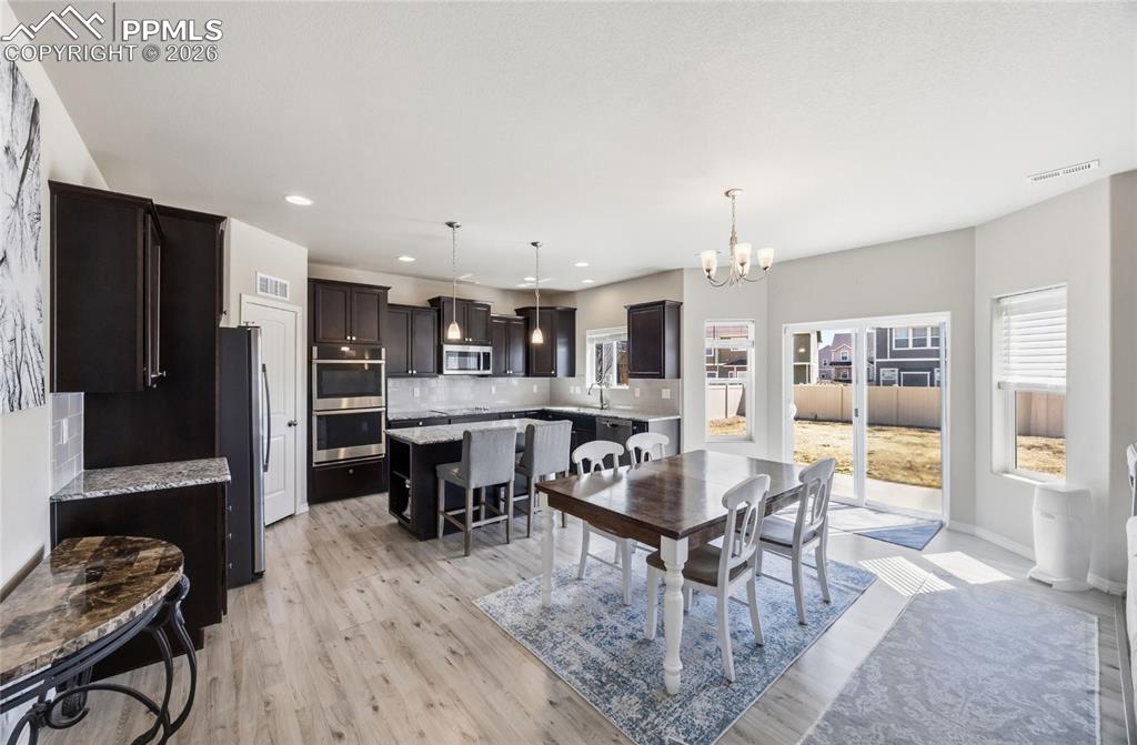 Image 12 of 41: View of Living Room and stairs to the upper level.