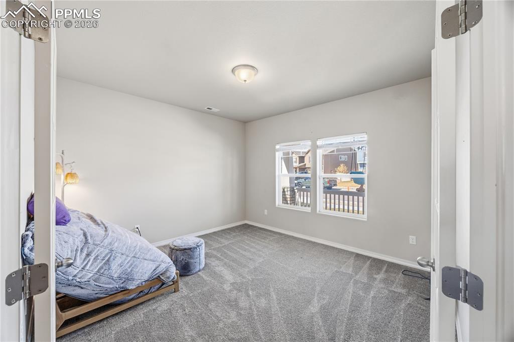 Image 6 of 41: Low maintenance xeriscaped yard.