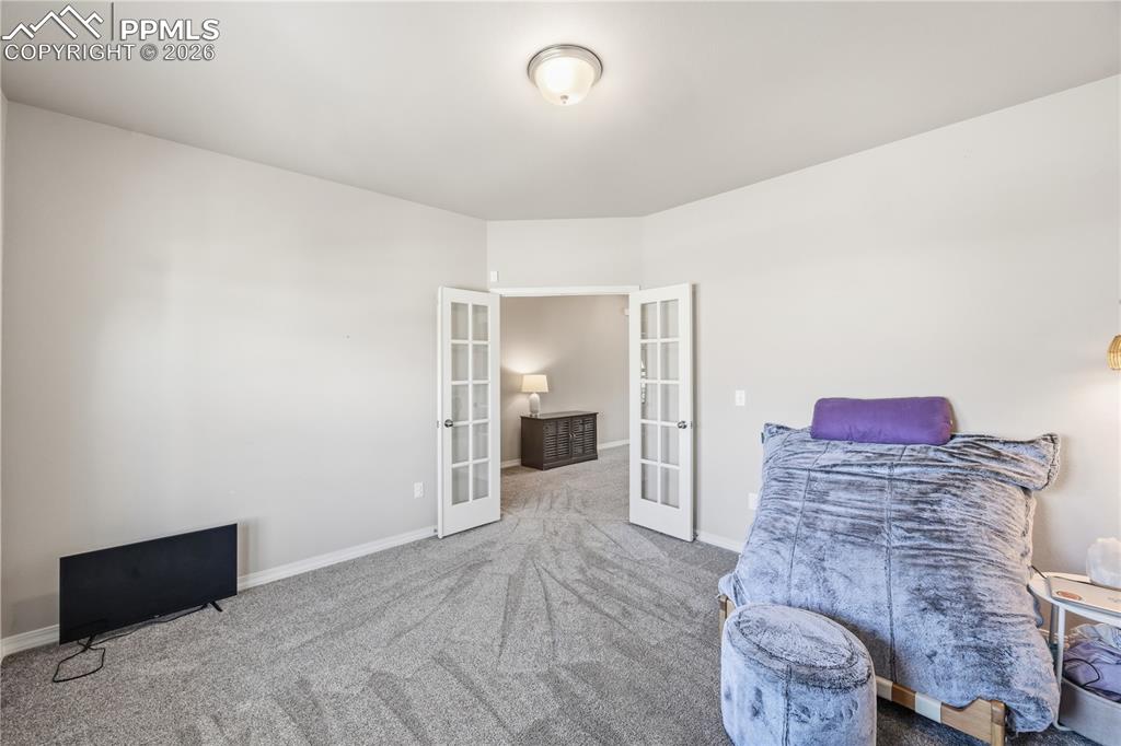 Image 7 of 41: Front Entry with view of the French doors into the home office (currently u