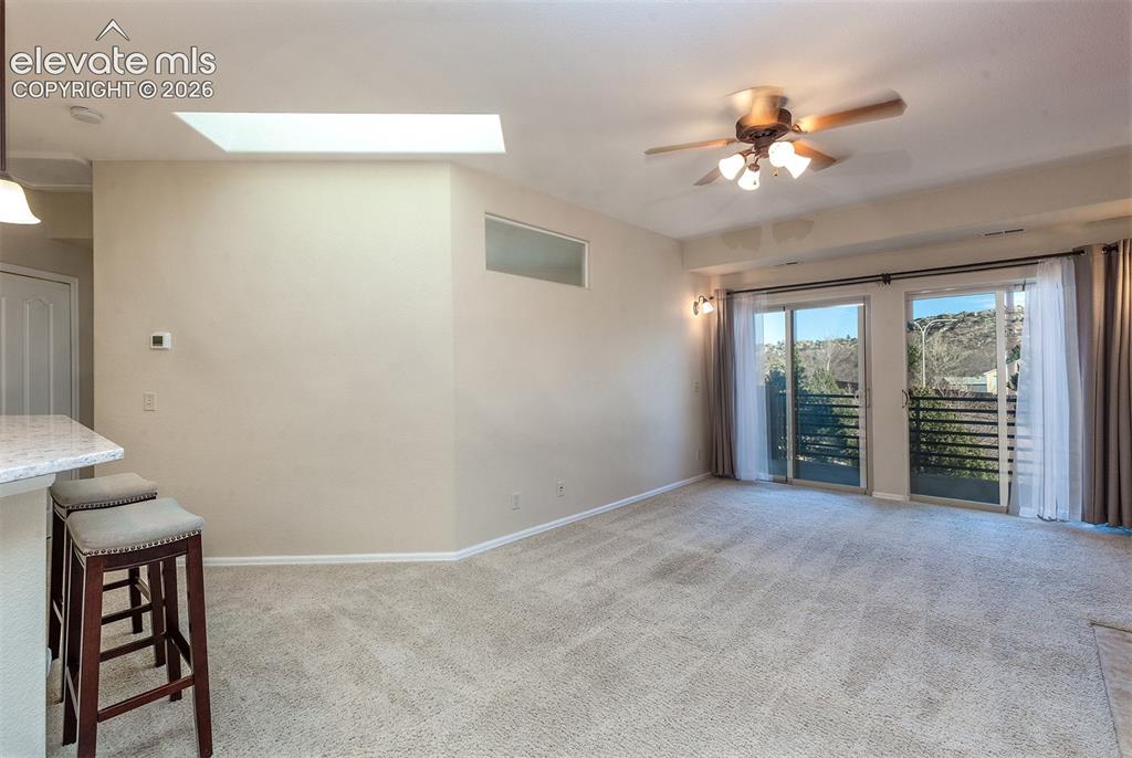 Image 10 of 23: Breakfast bar and living area