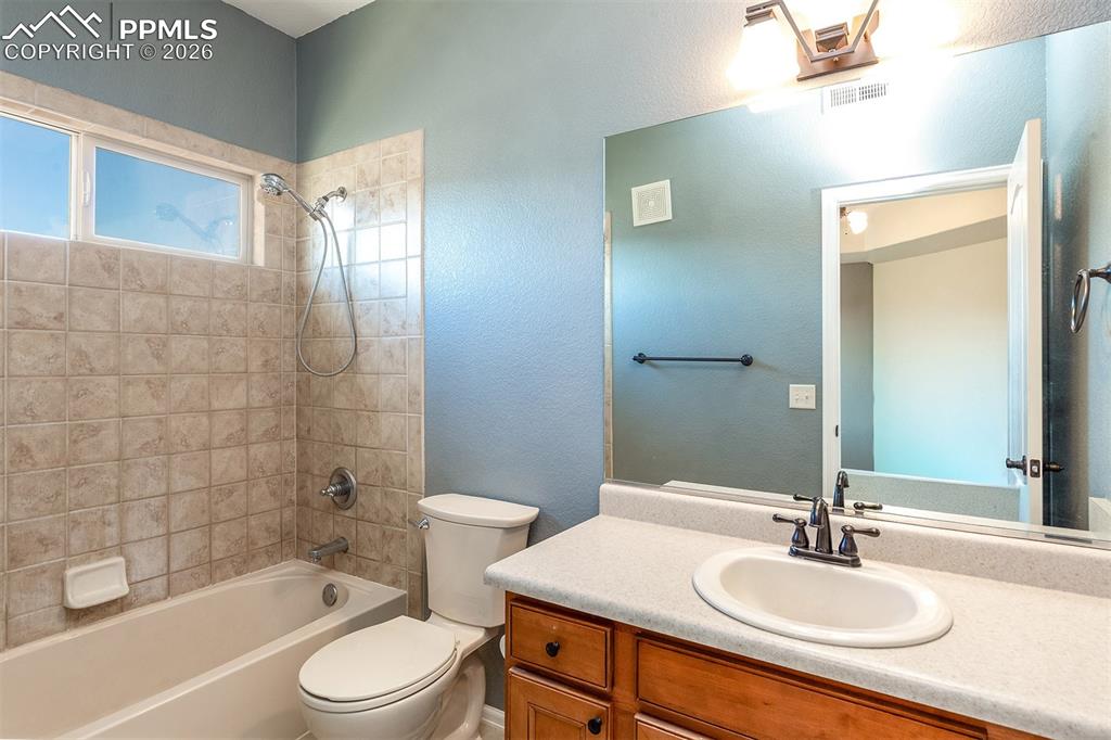 Image 14 of 23: Primary bathroom attached to bedroom