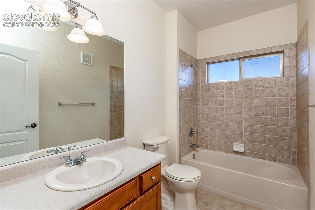Image 18 of 23: 2nd bathroom near laundry and 2nd bedroom