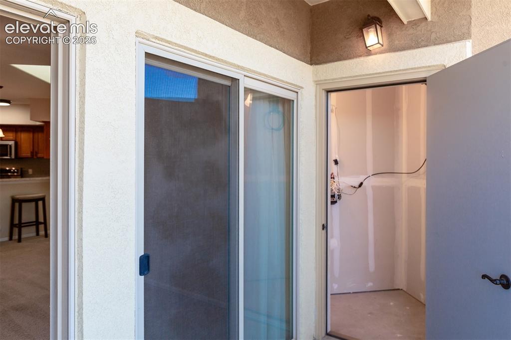 Image 19 of 23: Patio has storage closet and utility closet access