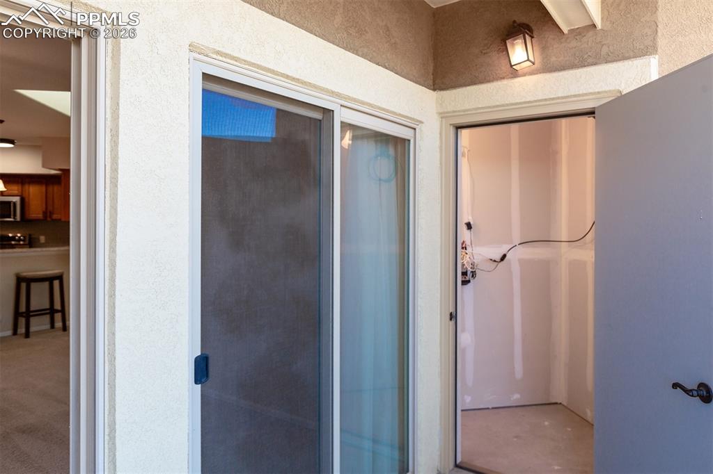 Image 20 of 23: Patio has storage closet and utility closet access