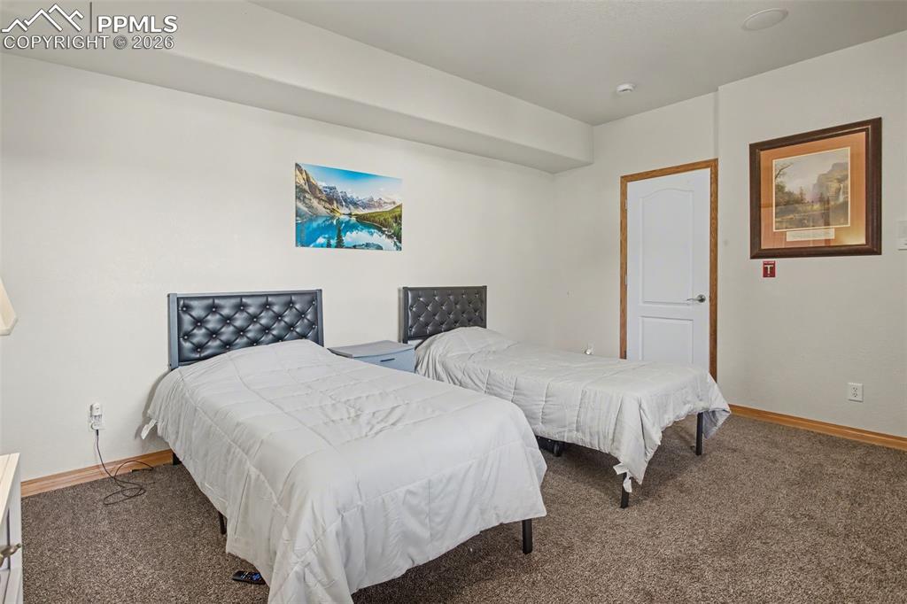 Image 36 of 48: Basement bedroom