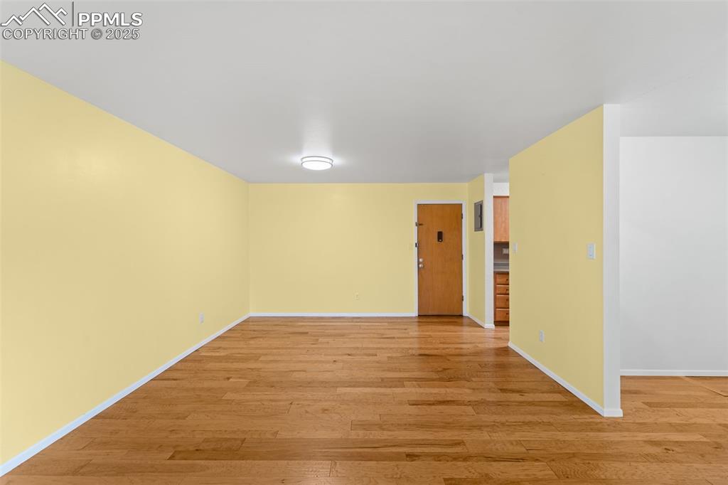 Image 13 of 23: Unfurnished room with light wood-type flooring and baseboards