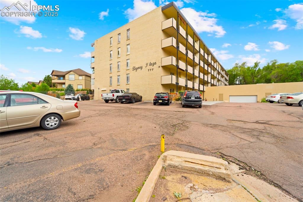 Image 2 of 23: View of property with uncovered parking