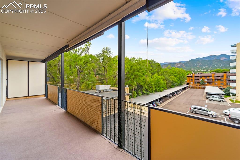 Image 20 of 23: Unfurnished sunroom featuring a mountain view