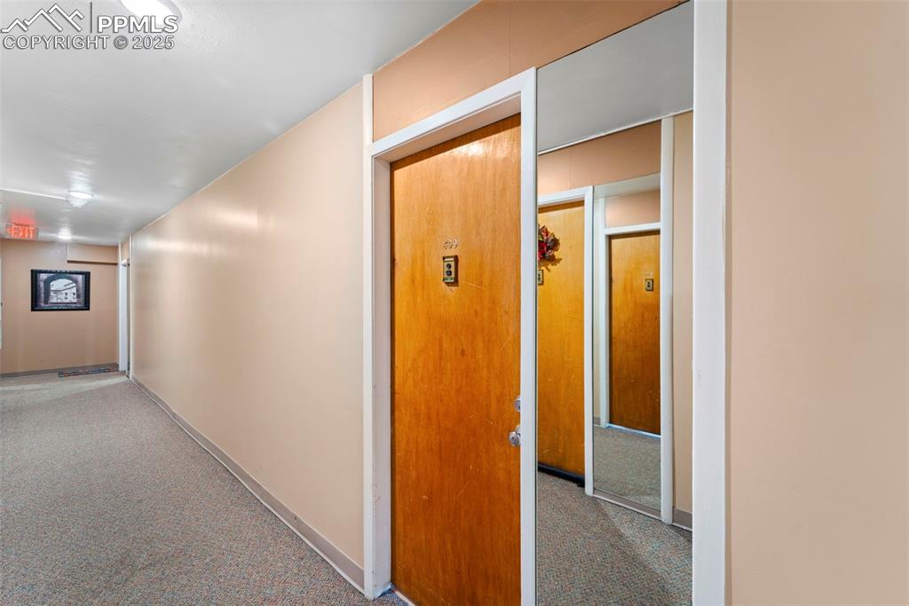 Image 4 of 23: Hall featuring carpet and baseboards