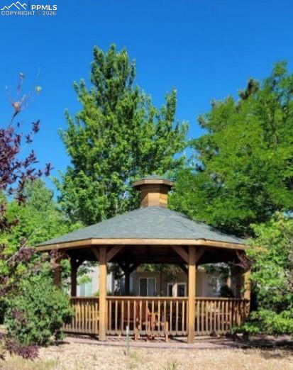 Image 29 of 50: Gazebo during the summer months with full foliage on trees