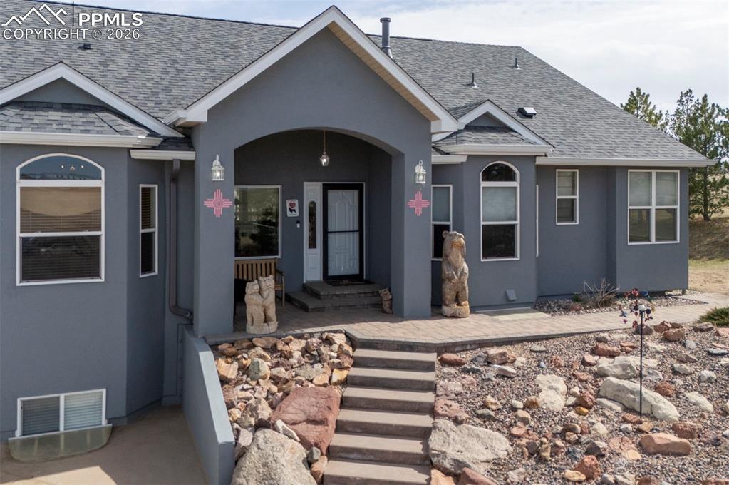Image 3 of 50: Low maintenance Stucco exterior, easy main level living, ranch home on 60 a