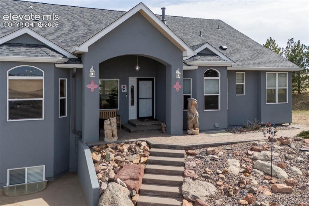 Image 4 of 50: Low maintenance Stucco exterior, easy main level living, ranch home on 60 a