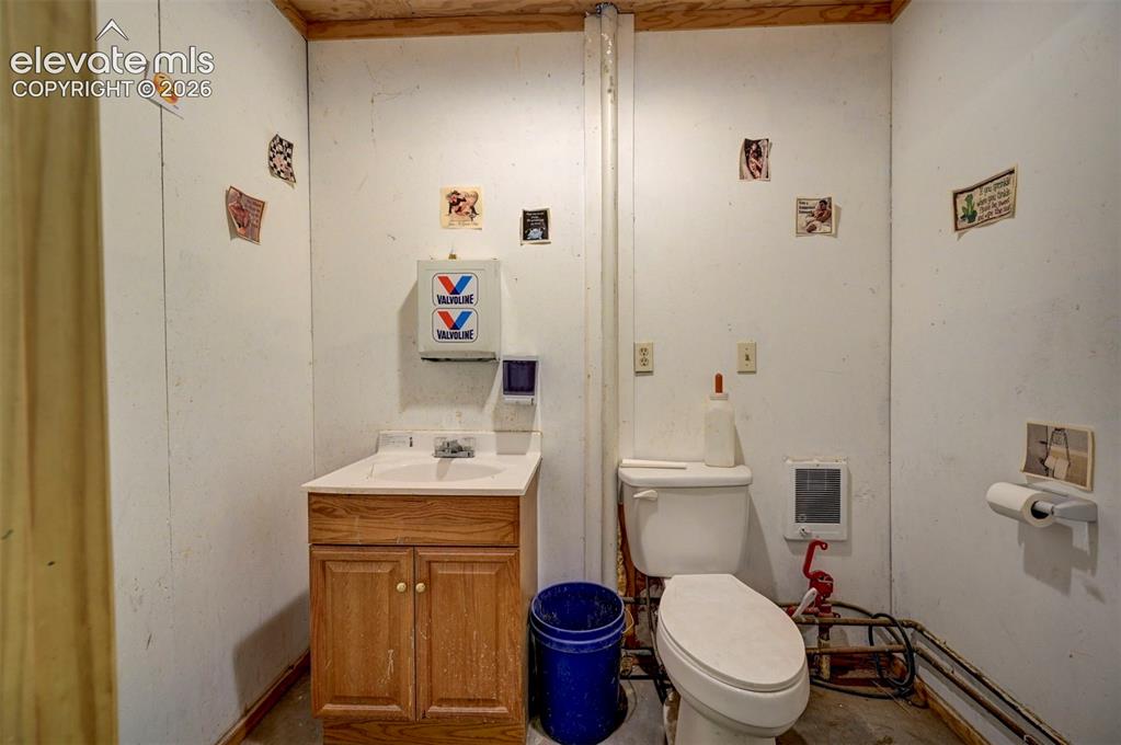 Image 42 of 50: Half bath located in tack room