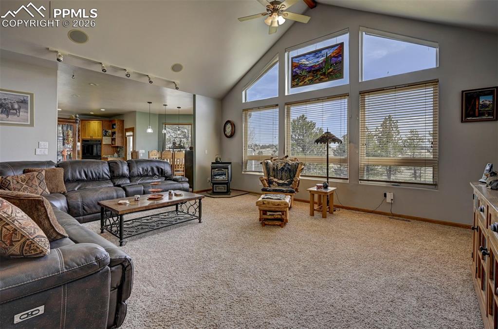 Image 6 of 50: Great room with floor to ceiling windows to let in an abundance of natural