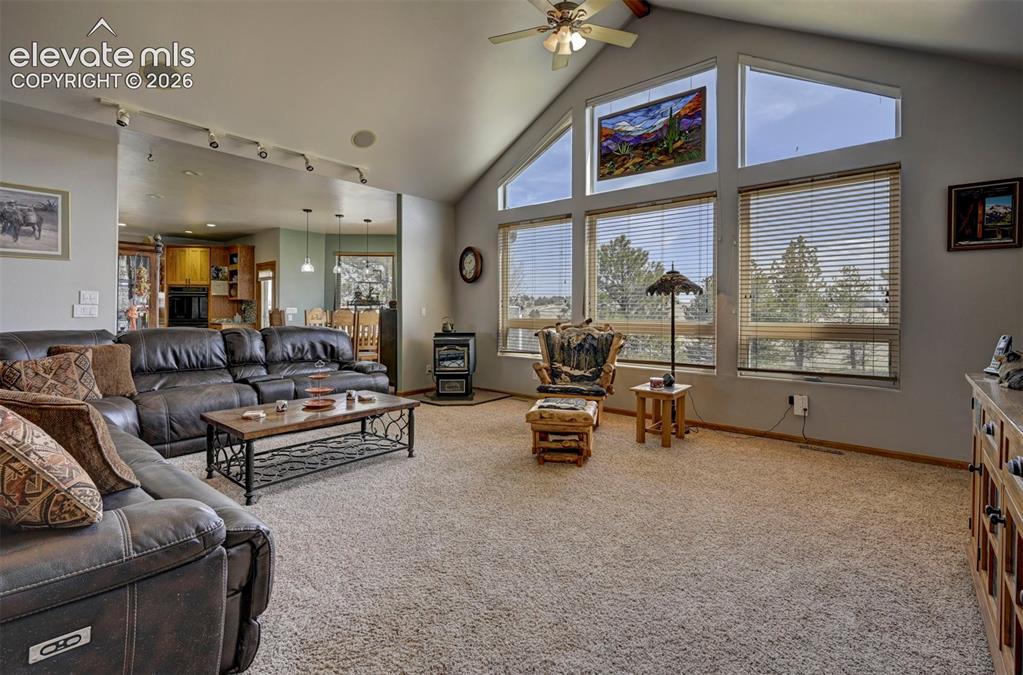 Image 7 of 50: Great room with floor to ceiling windows to let in an abundance of natural
