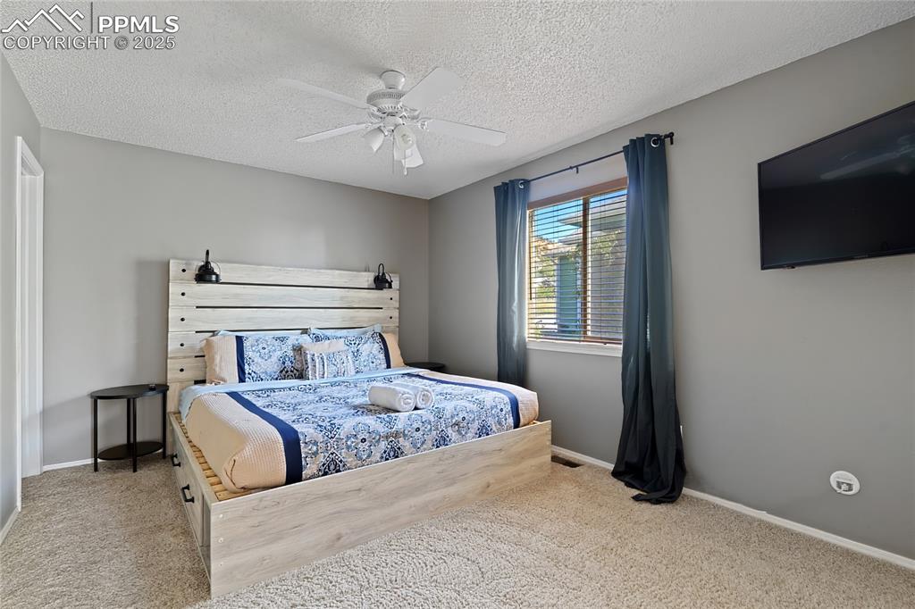 Image 10 of 37: Main Level Primary Suite (There