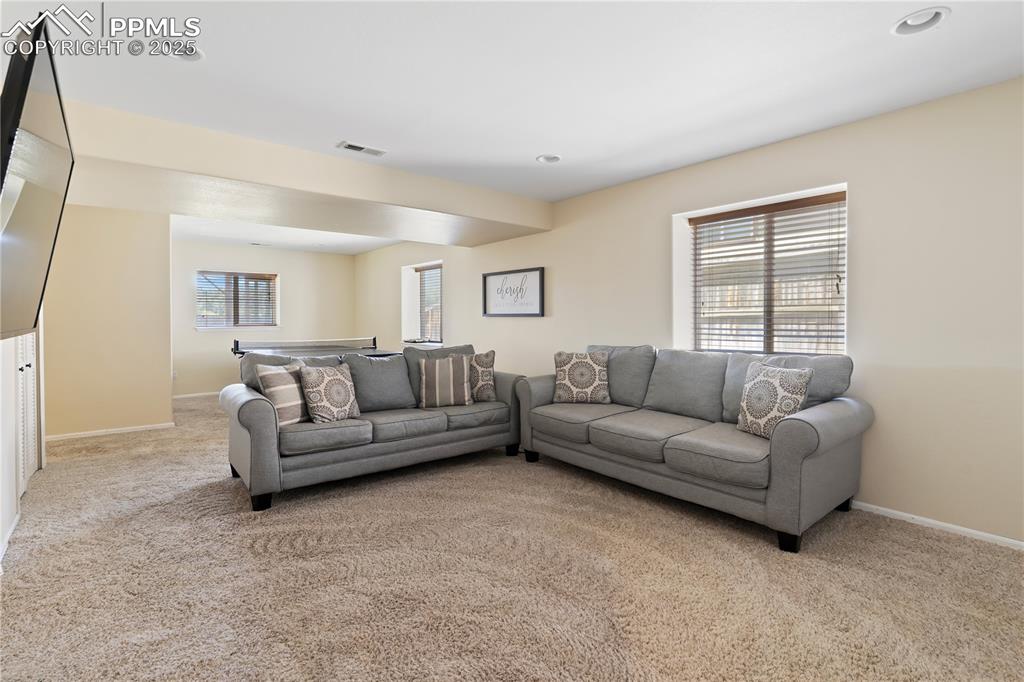 Image 17 of 37: Garden-level windows keep the space bright!