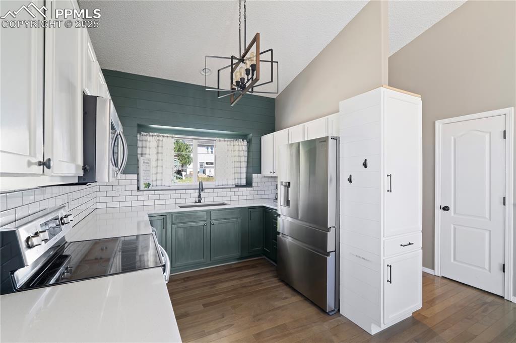 Image 2 of 37: Gorgeous & bright space w/engineered-hardwood flooring!