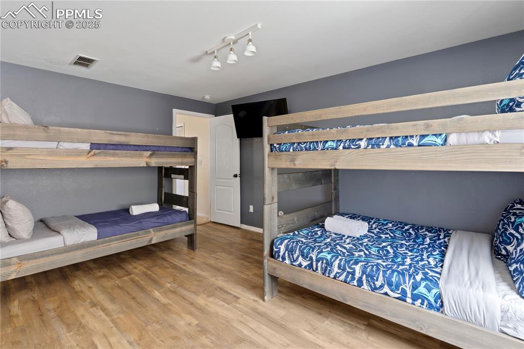 Image 24 of 37: Lower level bunk room...this place sleeps as a STR!