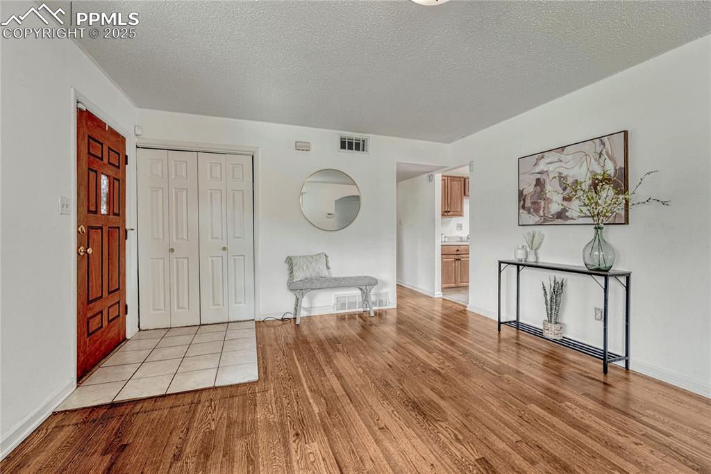 Image 10 of 43: Back inside, view of the entry with coat closet