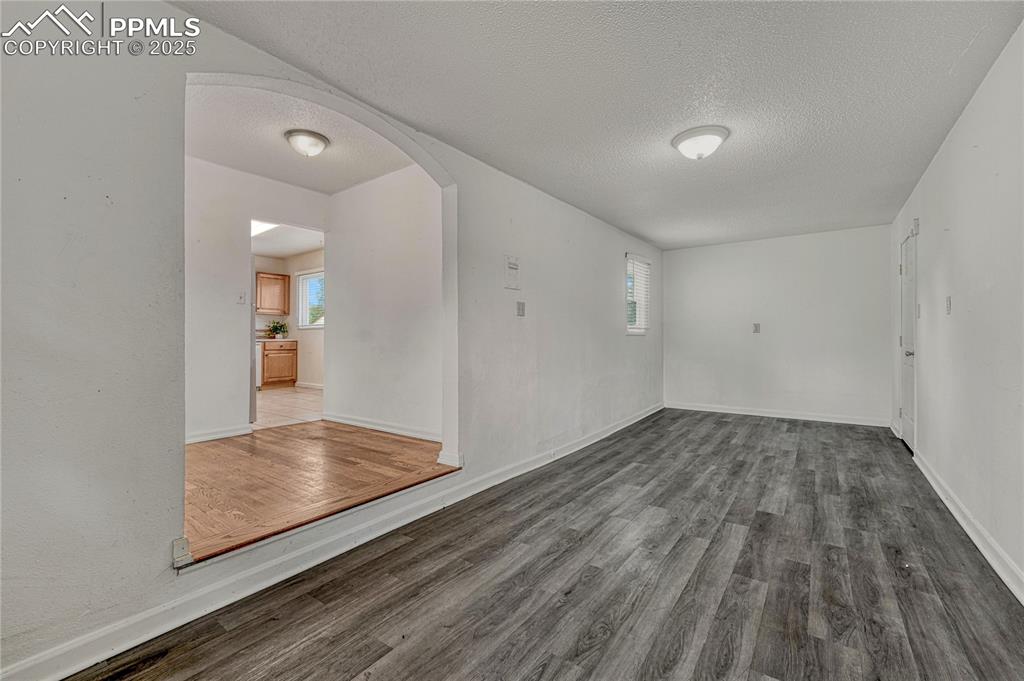Image 17 of 43: Flex space with laminate flooring can be used as an office or family room a