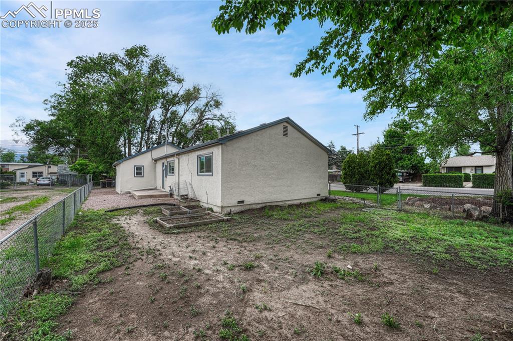 Image 37 of 43: Side yard.  So much potential to design this space how you want!  