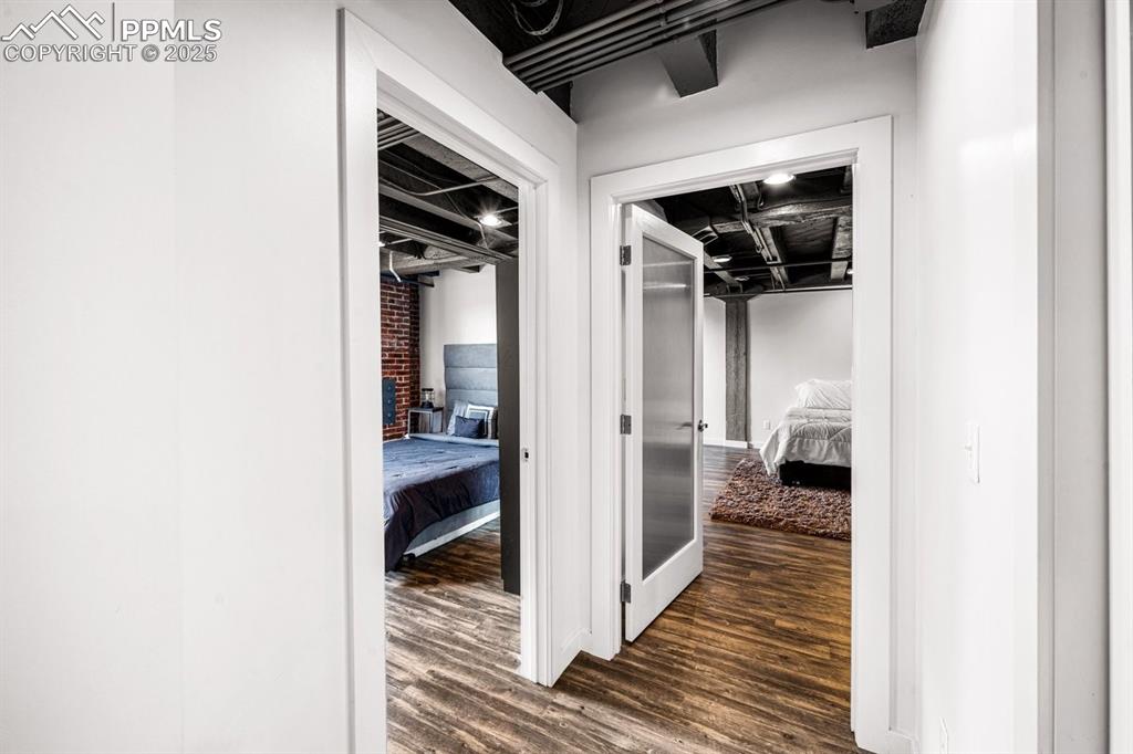 Image 18 of 32: Corridor with dark wood finished floors