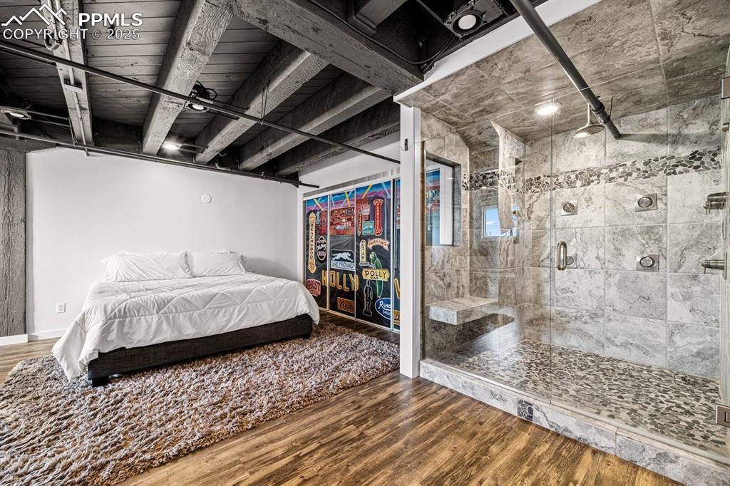 Image 23 of 32: Bedroom featuring wood finished floors