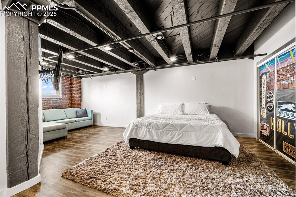 Image 28 of 32: Bedroom featuring wood finished floors