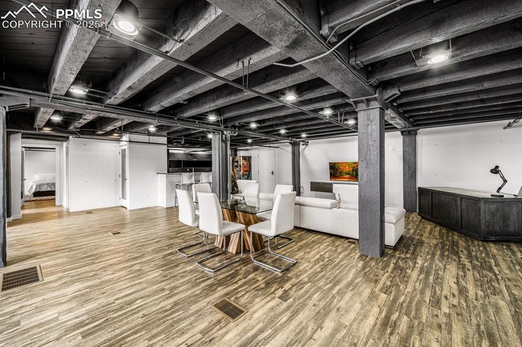 Image 6 of 32: Finished below grade area with wood finished floors