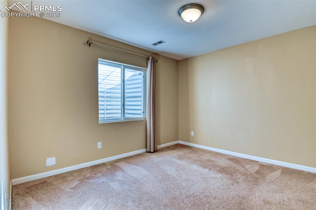 Image 29 of 50: basement bedroom