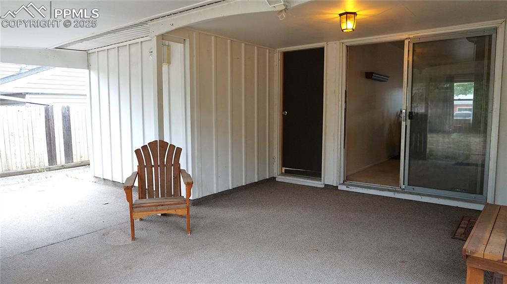 Image 16 of 23: Covered patio with doors to garage, dining room, and kitchen