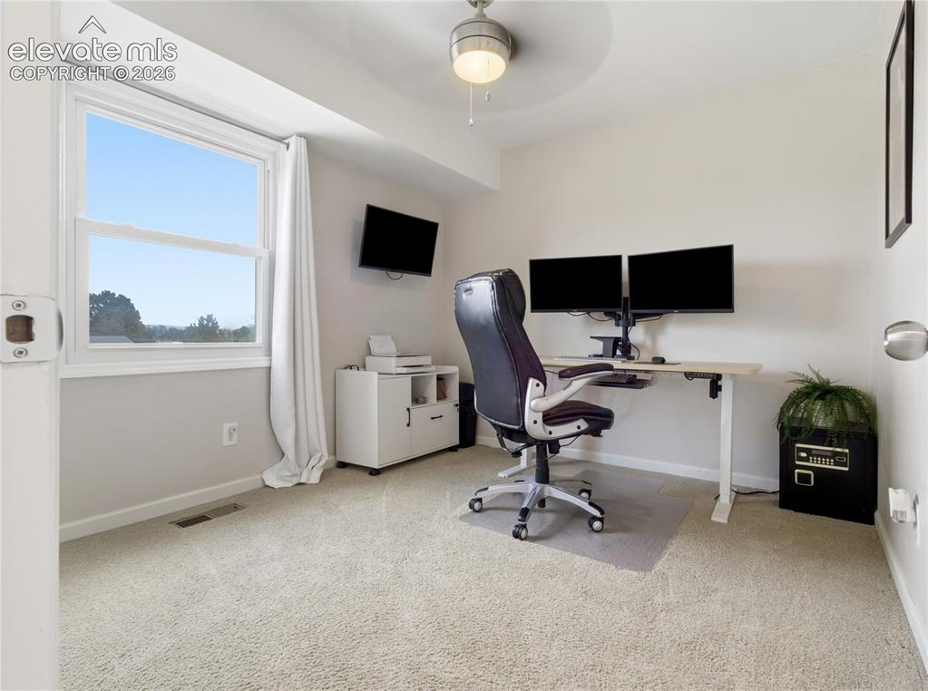 Image 21 of 29: Secondary bedroom being used as an office
