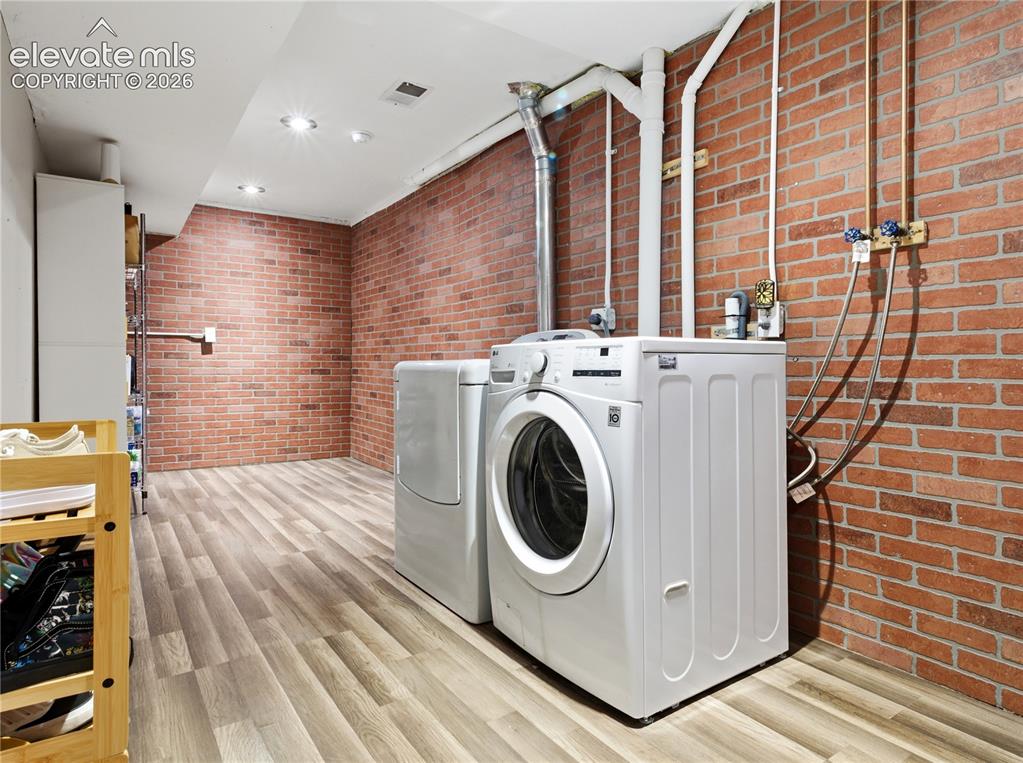 Image 23 of 29: Laundry room off the garage flooring, recessed lighting, and a drop ceiling