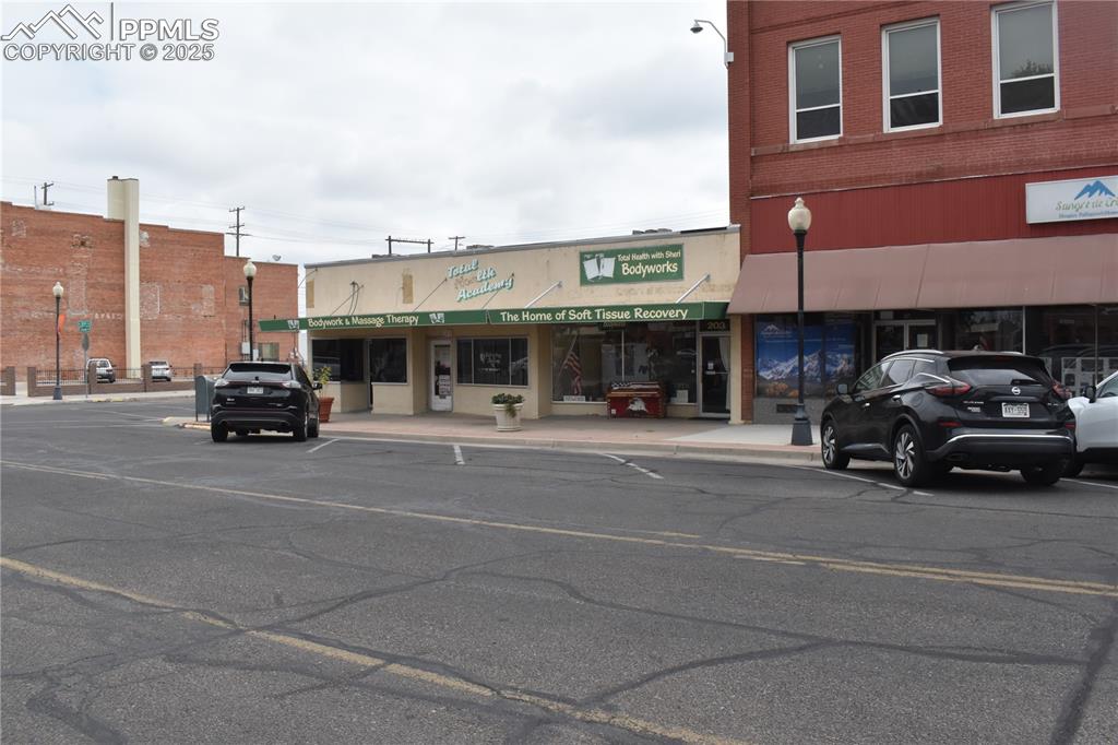 Caption: View of commercial property featuring uncovered parking