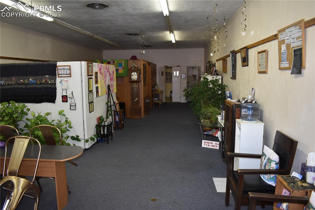 Image 11 of 37: Misc room with carpet