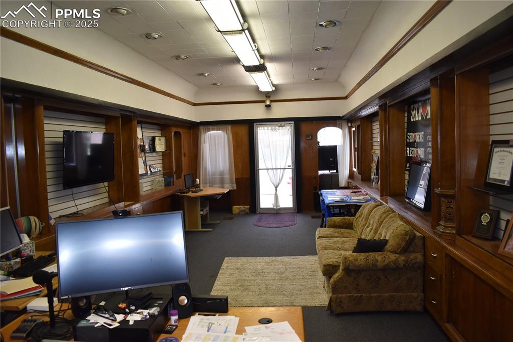 Image 14 of 37: Reception area featuring wooden walls