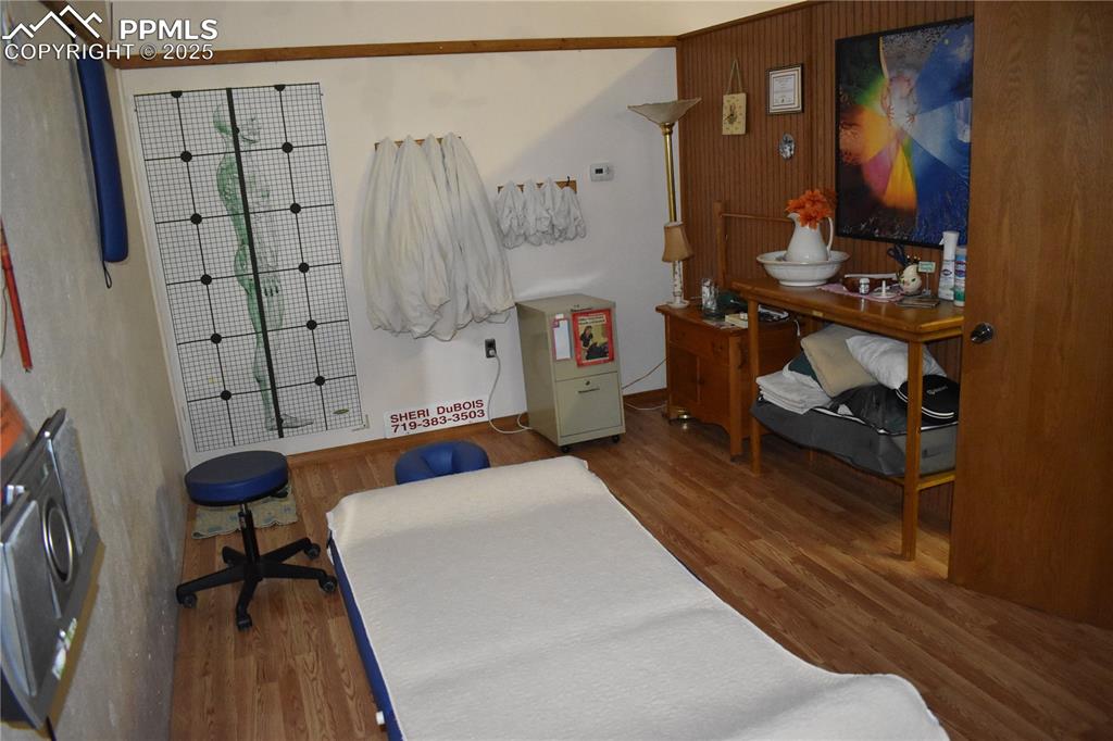 Image 6 of 37: Bedroom with wood finished floors