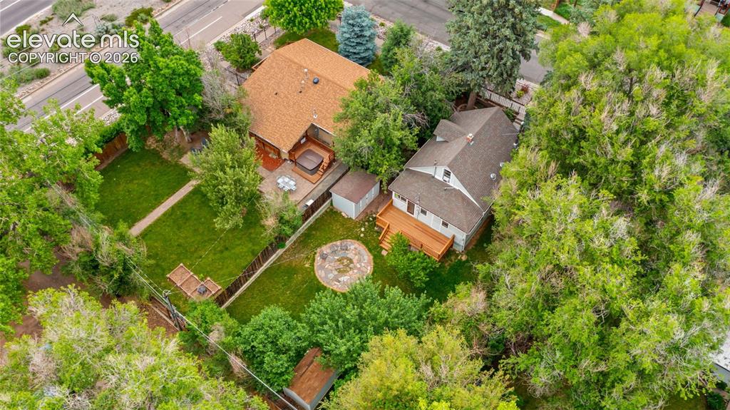 Image 32 of 38: Aerial perspective showcasing two distinct structures, each with a shingle